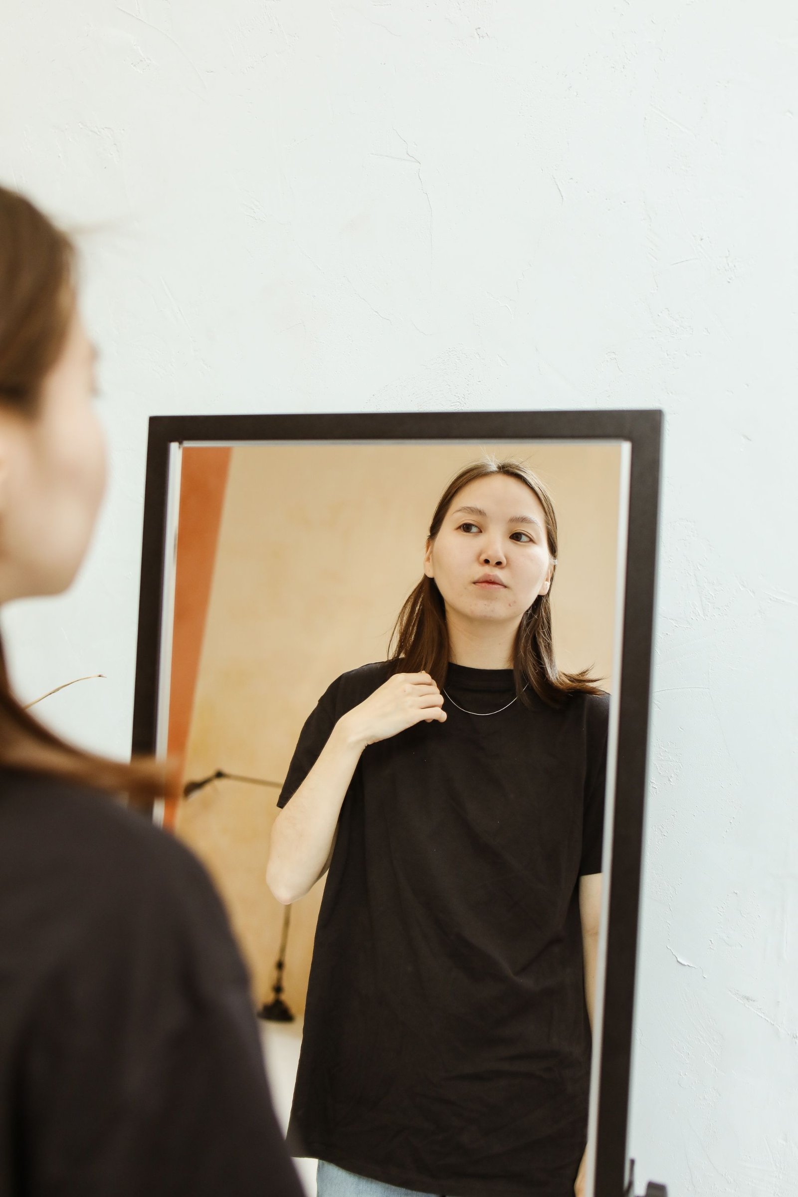 Woman looking in a mirror